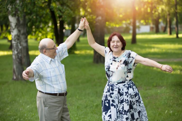 Couple dancing in park