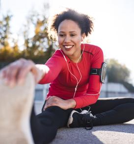 A woman stretches to relieve plantar fasciitis.